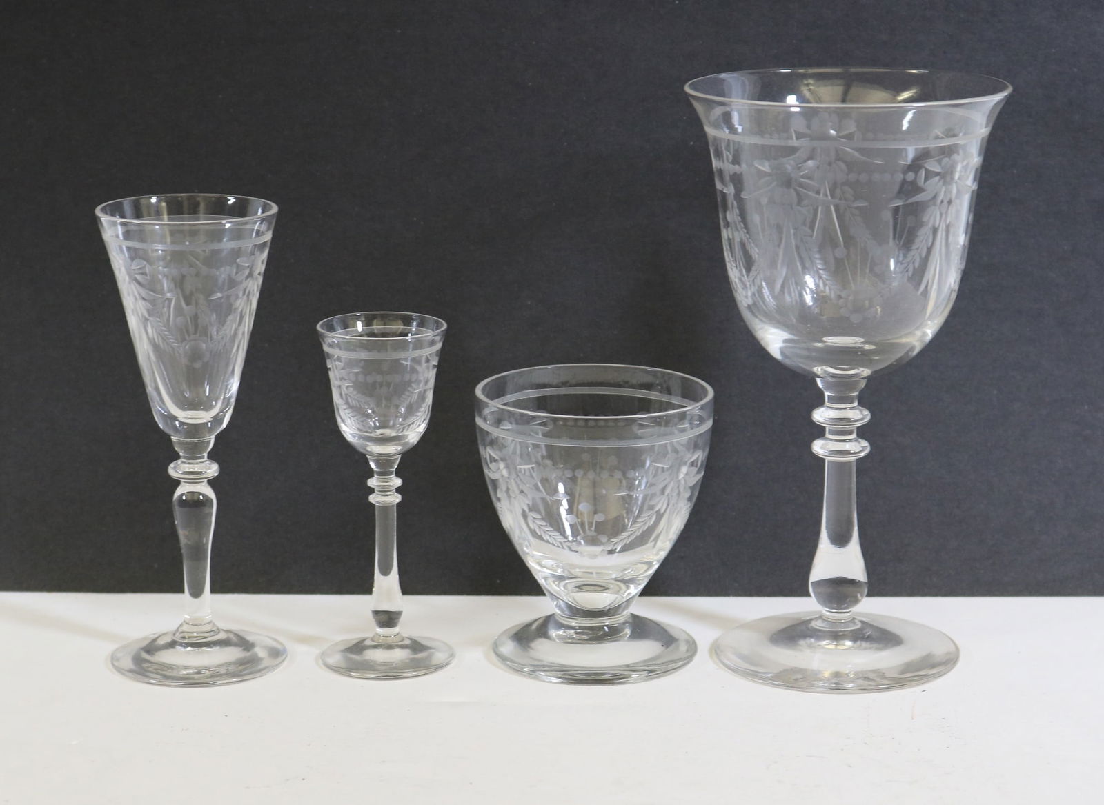 51-PIECE SERVICE ETCHED COLORLESS CLEAR GLASS STEMWARE. late 19th-early 20th century. (1 of 12)