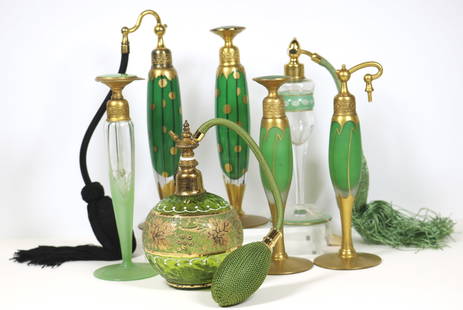 SEVEN ART DECO AND OTHER GREEN AND GILT DECORATED PERFUME BOTTLES AND ATOMIZERS, - Tallest, H: 7 5/8: SEVEN ART DECO AND OTHER GREEN AND GILT DECORATED PERFUME BOTTLES AND ATOMIZERS. Including two sets, each signed Devilbiss. - Tallest, H: 7 5/8 in.