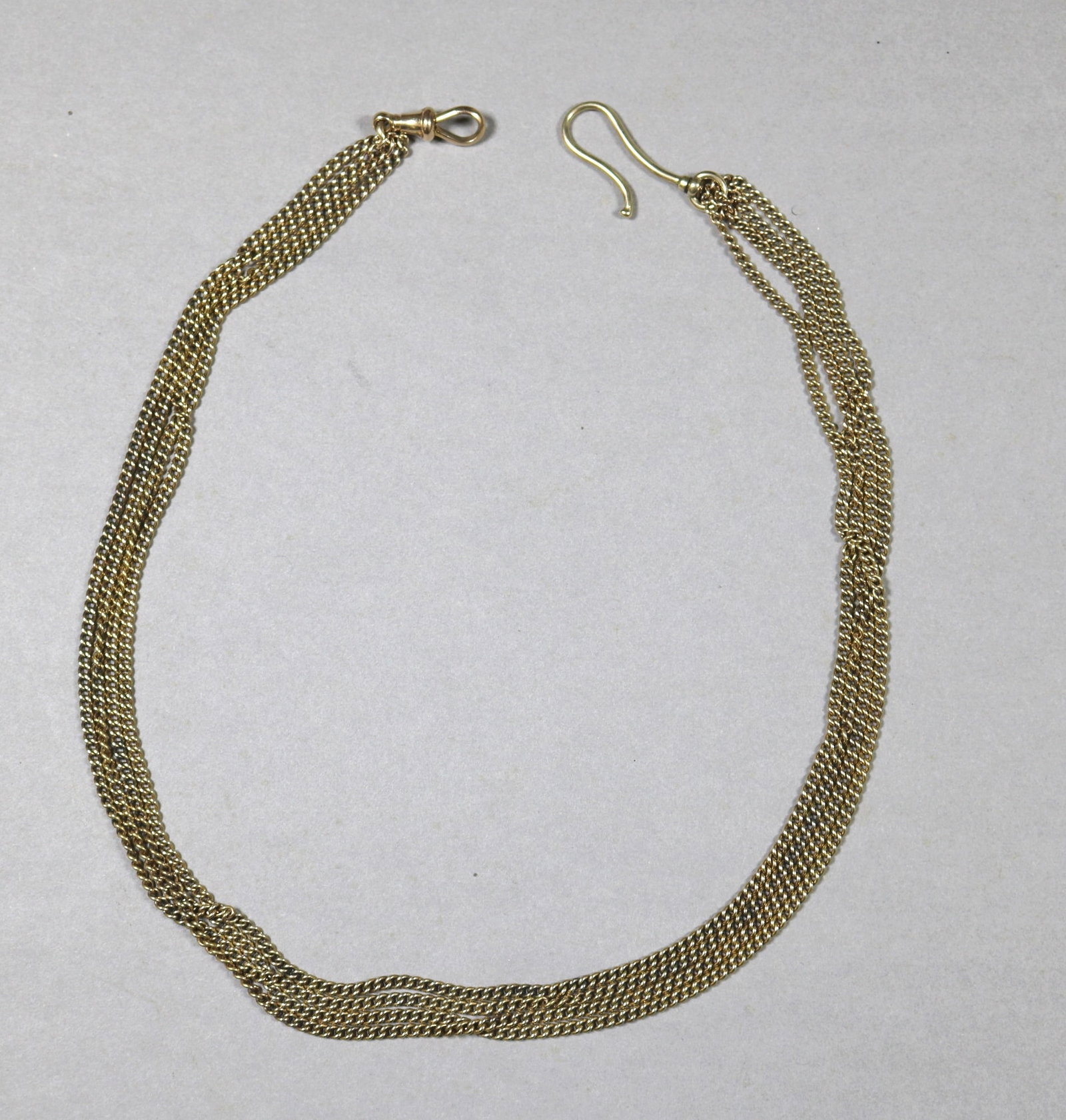 ITALIAN 14K BRIGHT-POLISHED YELLOW GOLD OMEGA-LINK FLEXIBLE STRAP CHOKER.: ITALIAN 14K BRIGHT-POLISHED YELLOW GOLD OMEGA-LINK FLEXIBLE STRAP CHOKER. L: 17"; W: 5 /16". Wt: 1 oz. 12 dwt.