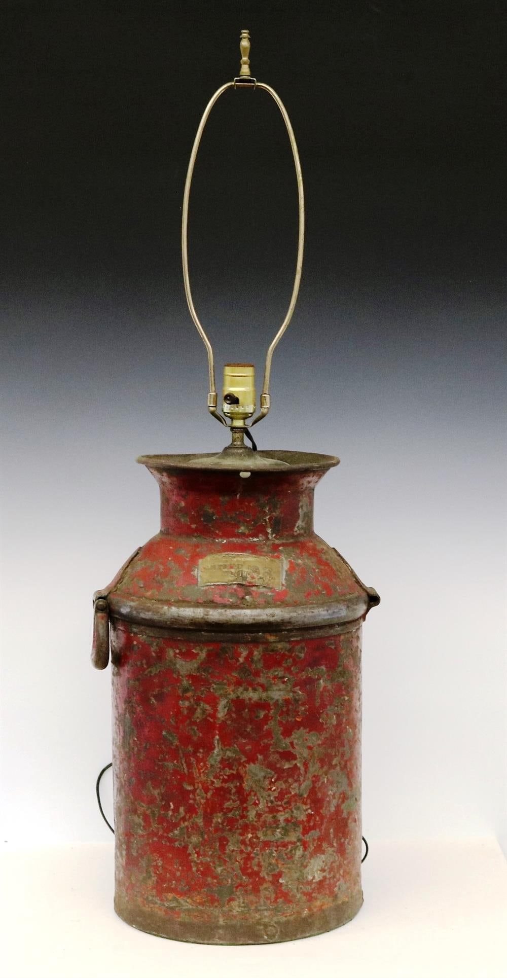 BALTIMORE OIL COMPANY METAL OIL JUG MOUNTED AS TABLE LAMP WITH SHADE HANDPAINTED WITH OIL RIGS. -: BALTIMORE OIL COMPANY METAL OIL JUG MOUNTED AS TABLE LAMP WITH SHADE HANDPAINTED WITH OIL RIGS. Jar bears brass label reading "Baltimore Oil Co./Baltimore, MD/50.2788", old red paint- - Jug, H: 19 in