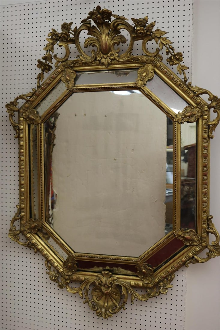 BAROQUE 17TH CENTURY STYLE GILTWOOD OCTAGONAL WALL MIRROR. High-relief carved flowering vine (1 of 6)