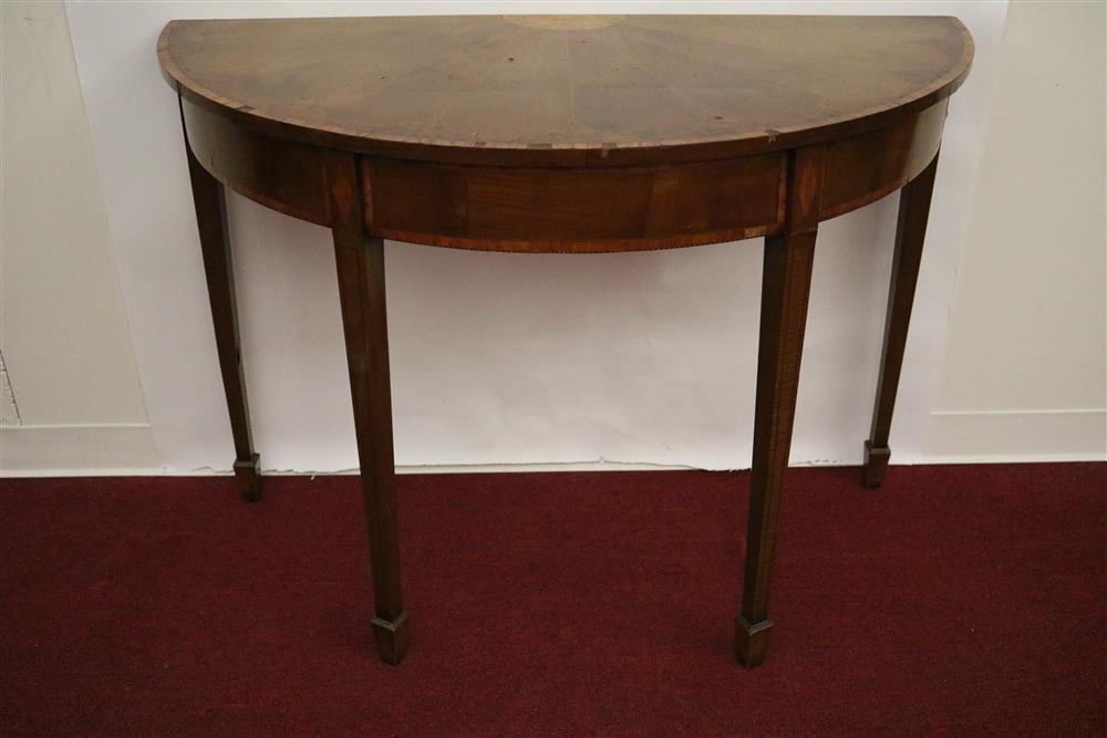 PAIR HEPPLEWHITE STYLE INLAID BURL AND OTHER WOOD, DEMILUNE CONSOLE TABLES, 19th century. - H: 31: PAIR HEPPLEWHITE STYLE INLAID BURL AND OTHER WOOD, DEMILUNE CONSOLE TABLES, 19th century. Wedge-inlaid top with cross-banding; inlaid aprons and tapering square legs ending in spade feetVeneer loss at