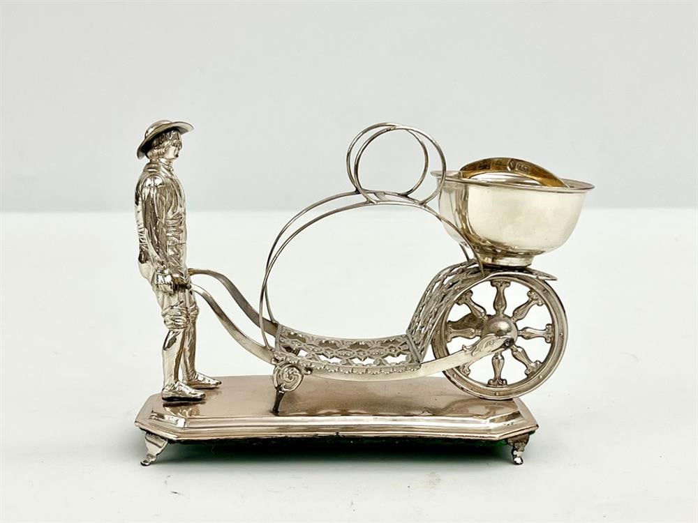 CONTINENTAL SILVER MINIATURE FIGURE OF MAN PUSHING CART WITH LARGE VESSEL. late 19th century,. - H: (1 of 3)