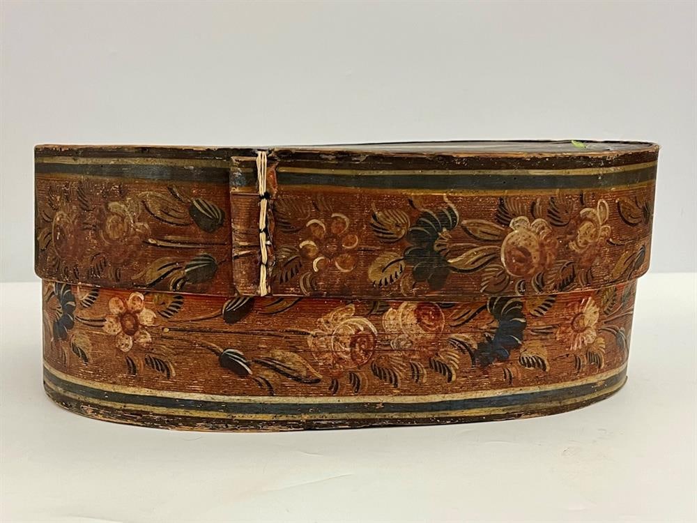 19TH CENTURY SWEDISH PAINTED WOODEN OVAL LIFT-COVER BOX,: 19TH CENTURY SWEDISH PAINTED WOODEN OVAL LIFT-COVER BOX. Top with figural decoration; floral-painted sides. H: 6 1/2"; top, 18 1/2" x 11 1/2".