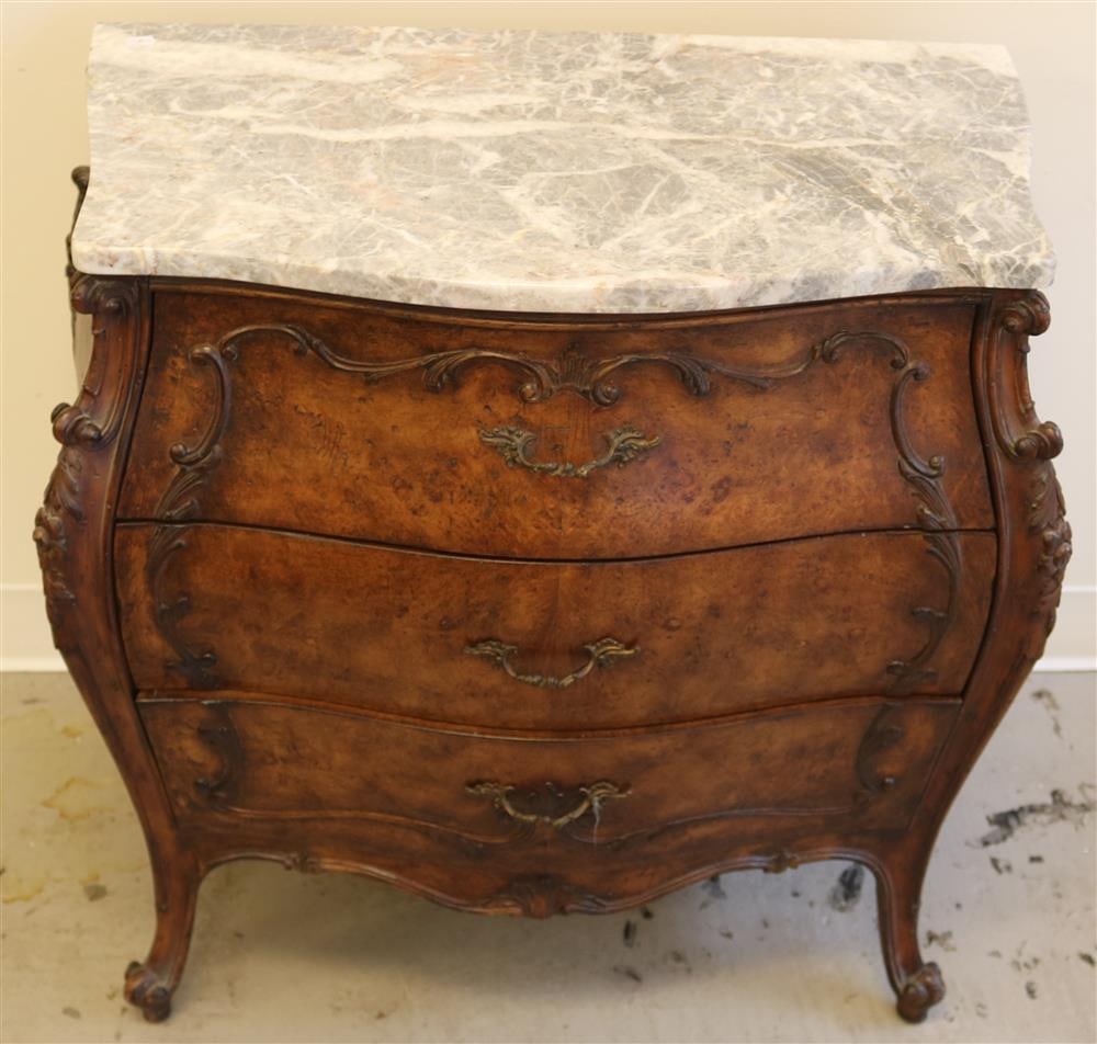 PAIR EARLY 20TH CENTURY LOUIS XV STYLE CARVED AND UPHOLSTERED BERGERES,: PAIR EARLY 20TH CENTURY LOUIS XV STYLE CARVED AND UPHOLSTERED BERGERES. Shape and molded frames; red rose damask upholstery; brass nailhead trim.