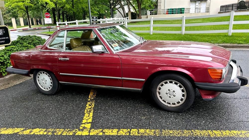 1989 MERCEDES-BENZ 560SL TWO-DOOR RUBY RED METALLIC ROADSTER CONVERTIBLE AUTOMOBILE. - Mileage: