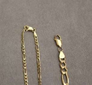 14K YELLOW GOLD FLEXIBLE-LINK BRACELET WITH 14K CHAIN NECKLACE OF MATCHING LINKS SUSPENDING PENDANT.
