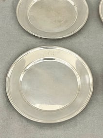 SET FIVE STERLING SILVER BREAD AND BUTTER PLATES, Monogrammed. - D: 6 in. Wt. 29 troy oz.