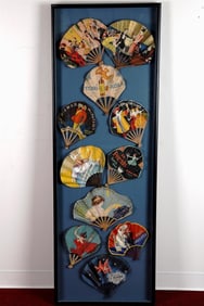 11 VINTAGE FRENCH ADVERTISING LITHOGRAPHED PAPER FOLDING FANS ARRANGED IN A SHADOW BOX FRAME.