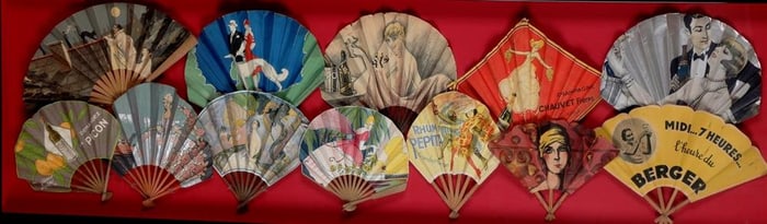 COLLECTION TWELVE VINTAGE ART DECO ADVERTISING LITHOGRAPHED FOLDING PAPER FANS MOUNTED IN A SHADOW