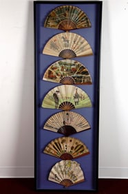 SEVEN FRENCH VINTAGE ADVERTISING LITHOGRAPHED PAPER FOLDING FANS ARRANGED IN A SHADOW BOX FRAME,