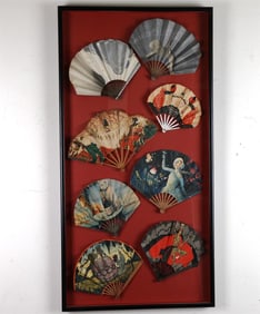 EIGHT FRENCH LITHOGRAPHED ADVERTISING PAPER FOLDING FANS, MOSTLY CHAMPAGNE, ARRANGED IN A SHADOWBOX