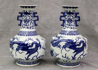 PAIR 20TH CENTURY CHINESE BLUE AND WHITE PORCELAIN DRAGON DECORATED TWO-HANDLE VASES. - H: 16".