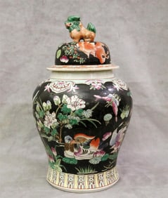 CHINESE POLYCHROMED PORCELAIN BALUSTER FORM JAR WITH LIFT-COVER HAVING FU LION FINIAL. - H: 18 1/2".
