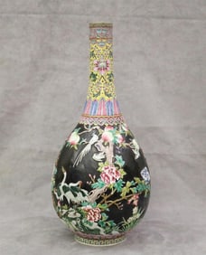 CHINESE FAMILLE ROSE DECORATED PORCELAIN BOTTLE VASE WITH NOIRE GROUND. - H: 21 3/4".