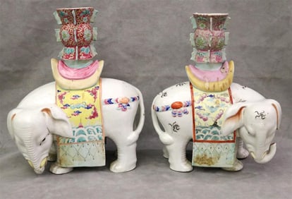 PAIR CHINESE POLYCHROMED PORCELAIN ELEPHANT-FORM VASES. - H: 14"; W: 11 1/2". (imperfections).