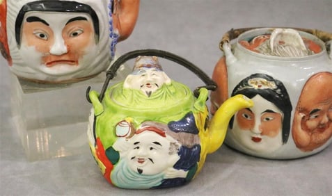 THREE JAPANESE POLYCHROME PORCELAIN "FACE" TEAPOTS. - Tallest, H: 4".
