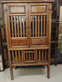 EARLY 20TH CENTURY TEAKWOOD, TWO DOOR CABINET, - H: 67"; W: 36"; D: 18 1/2".