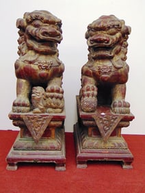 PAIR LATE 19TH CENTURY-EARLY 20TH CENTURY CHINESE CARVED AND PAINTED FIGURES OF SEATED FU DOGS. late