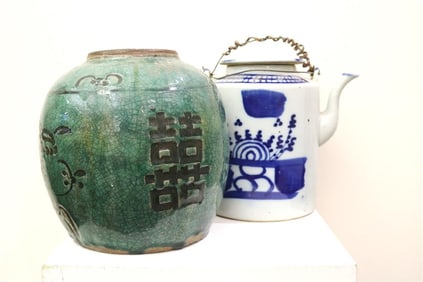 TWO CHINESE CERAMIC VESSELS. One, green crackle-glazed jar with character motifs, H: 8 in.; other,