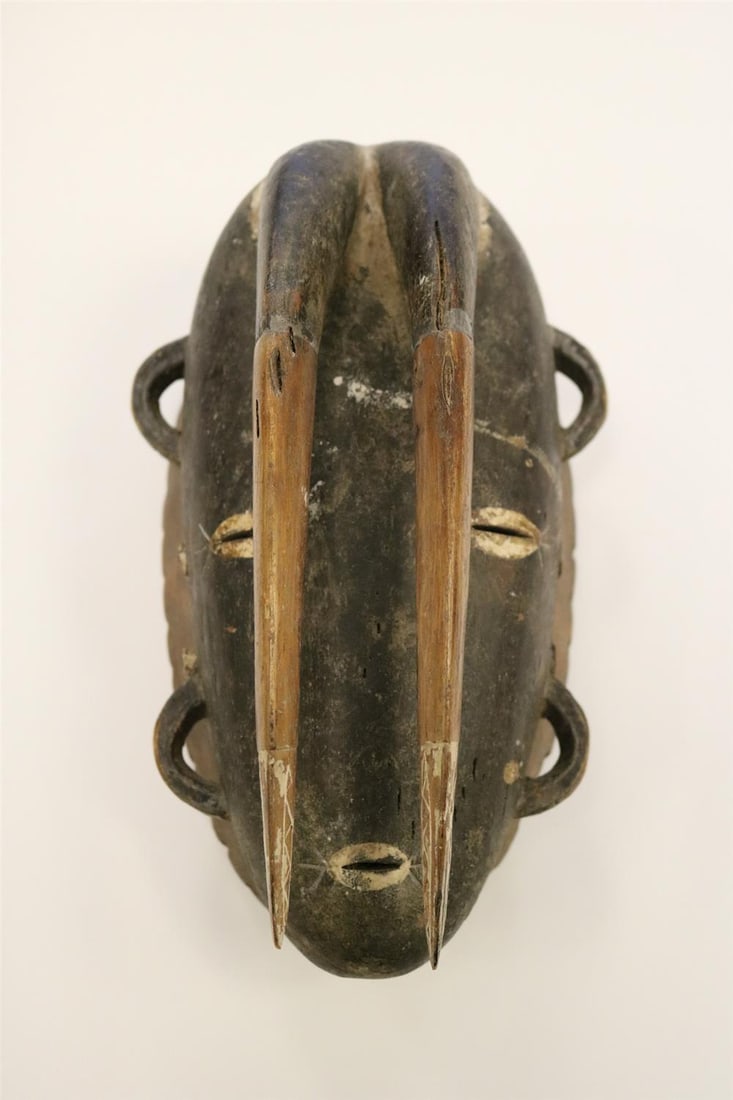 IVORY COAST AFRICAN WOODEN MASK WITH TWO HORNS, Mid-20th century. - Height: 11 inches. (1 of 14)