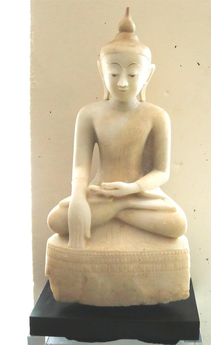 BURMESE SHAN STYLE CARVED ALABASTER BUDDHA. - height: 34 inches (including base); depth: 12 inches.: BURMESE SHAN STYLE CARVED ALABASTER BUDDHA. Traces of old color and gilt, Bhumisparsa mudra position (“calling the earth to witness”), mounted on a custom base. - height: 34 inches (including 