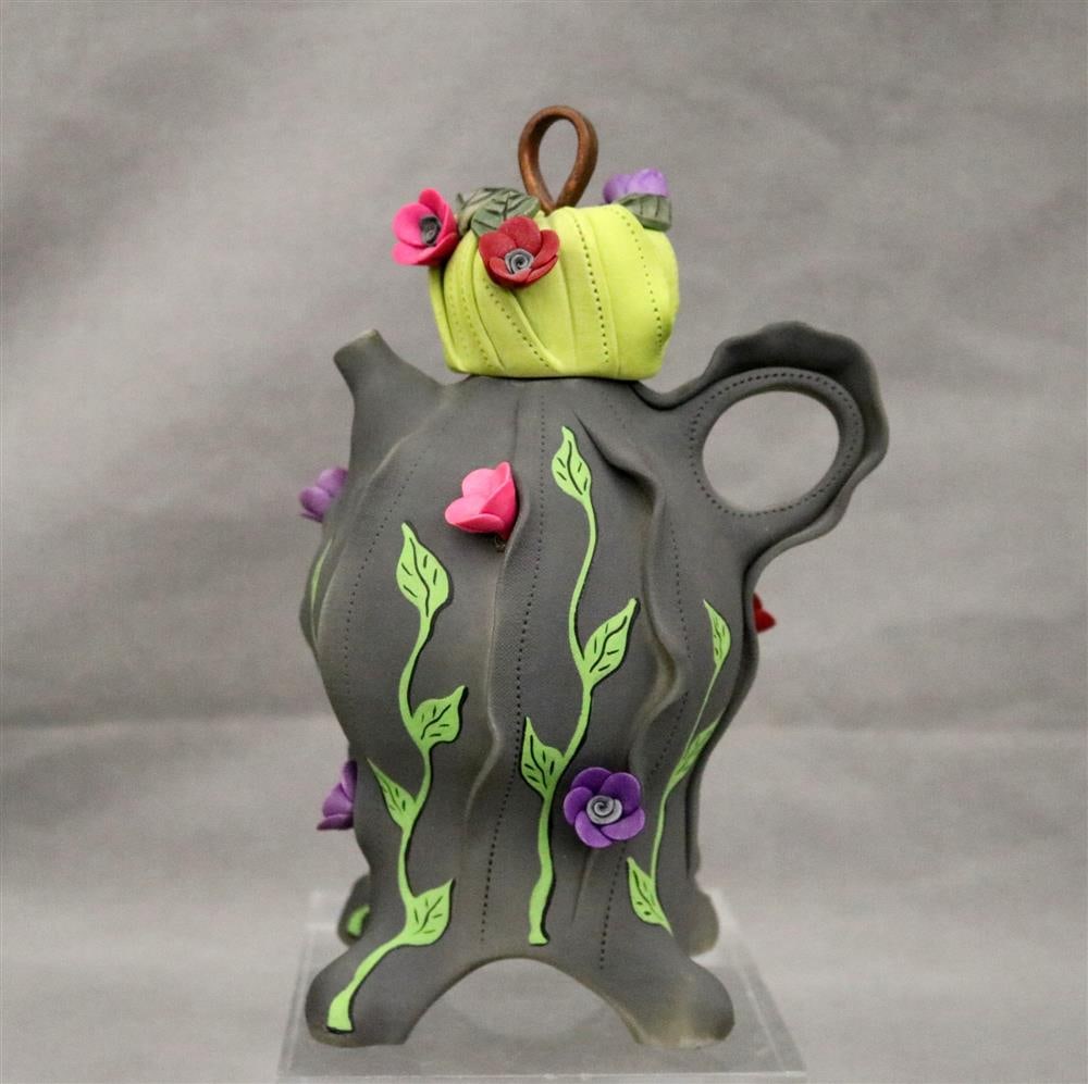 LAURA PEERY (American, born 1952). Whimsical ceramic teapot with applied floral blossoms.  Signed (1 of 16)