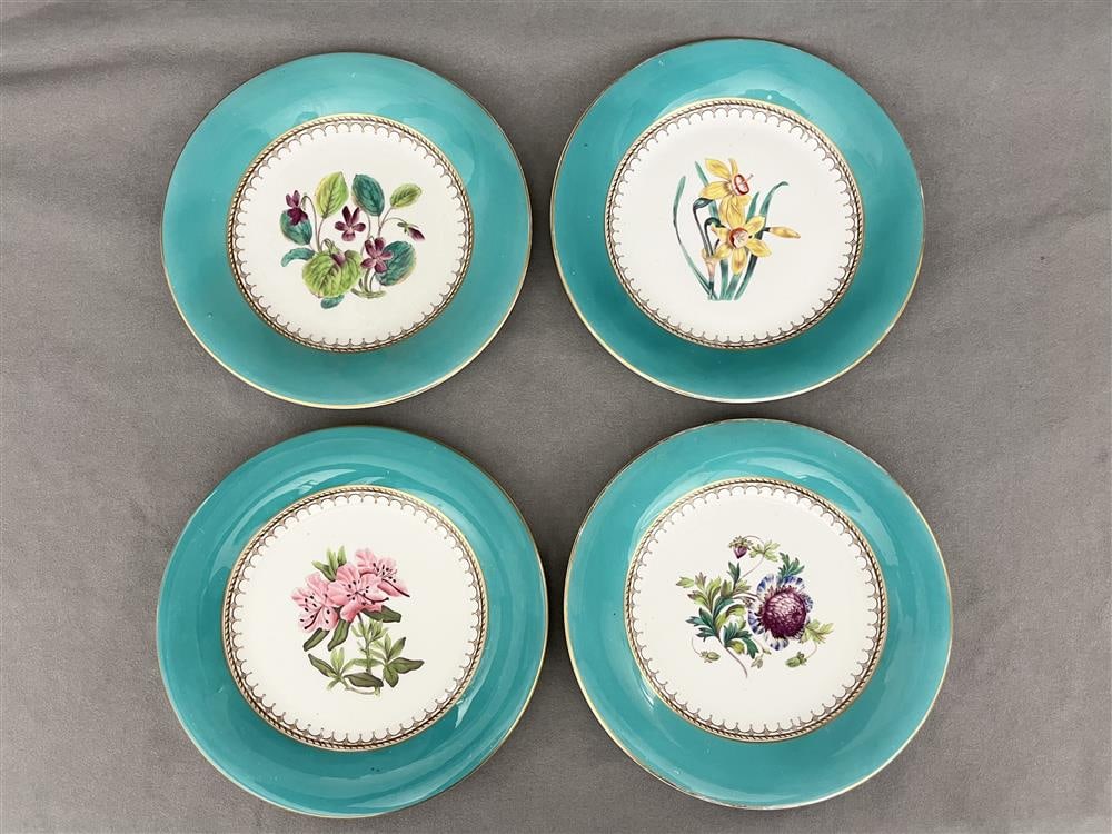 SET 12 LATE 19TH CENTURY TURQUOISE-BANDED PORCELIAN DESSERT PLATES. - D: 9 1/4".: SET 12 LATE 19TH CENTURY TURQUOISE-BANDED PORCELIAN DESSERT PLATES. Each centering different floral spray. - D: 9 1/4".