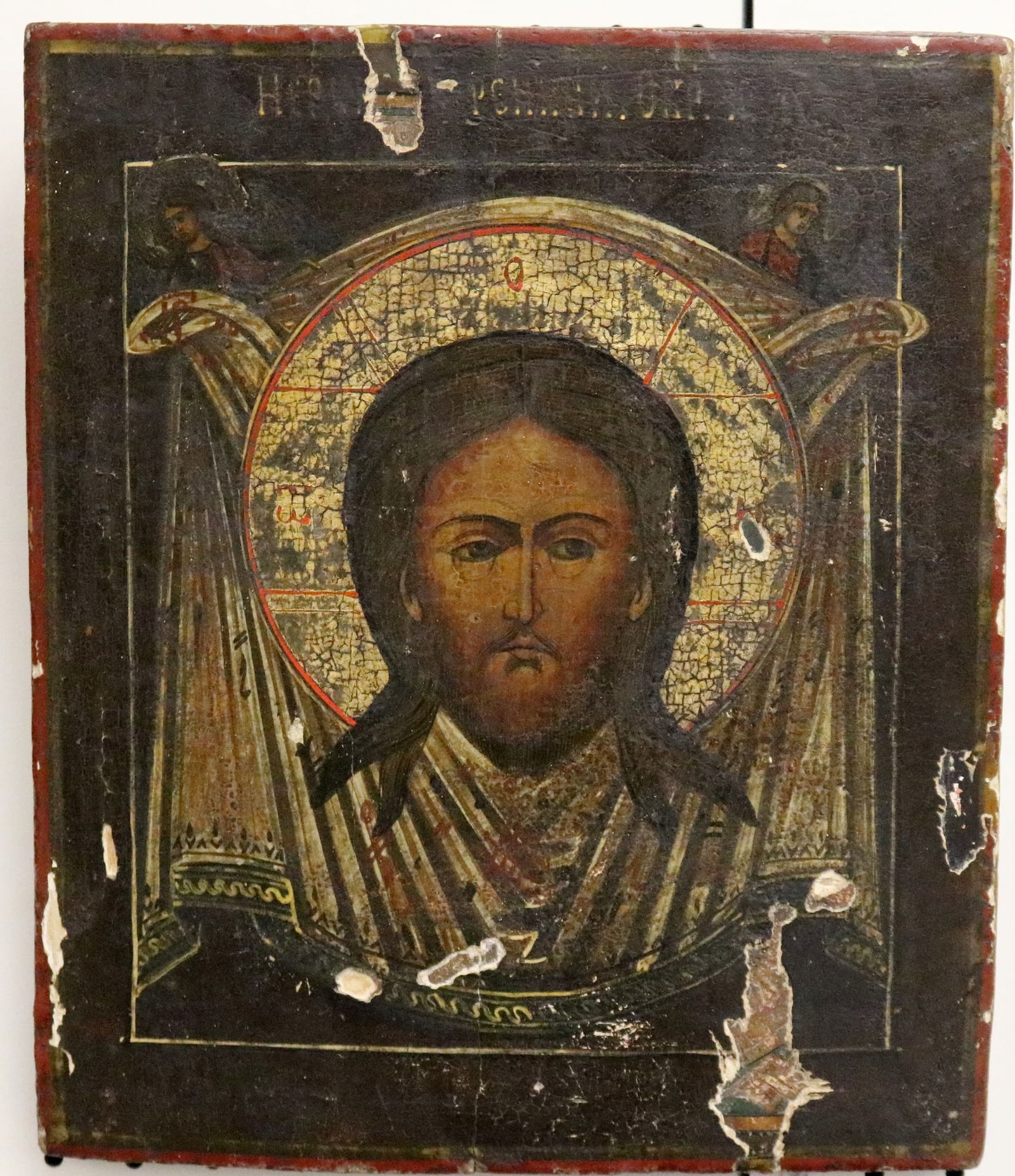 RUSSIAN ICON OF CHRIST, THE HOLY FACE (19th century or earlier). Tempera on wood panel. Icon depicts: RUSSIAN ICON OF CHRIST, THE HOLY FACE (19th century or earlier). Tempera on wood panel. Icon depicts the an image of Christ’s head with a cruciform halo on a cloth . Note: In Catholic tradition, th