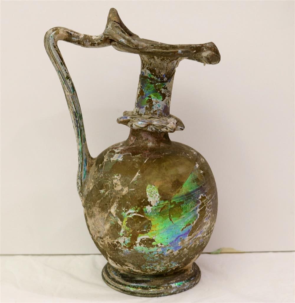 ANCIENT ROMAN IRIDESCENT GLASS JUG, 1st-2nd Century AD. - Height: 8.75 inches.: ANCIENT ROMAN IRIDESCENT GLASS JUG, 1st-2nd Century AD. - Height: 8.75 inches.