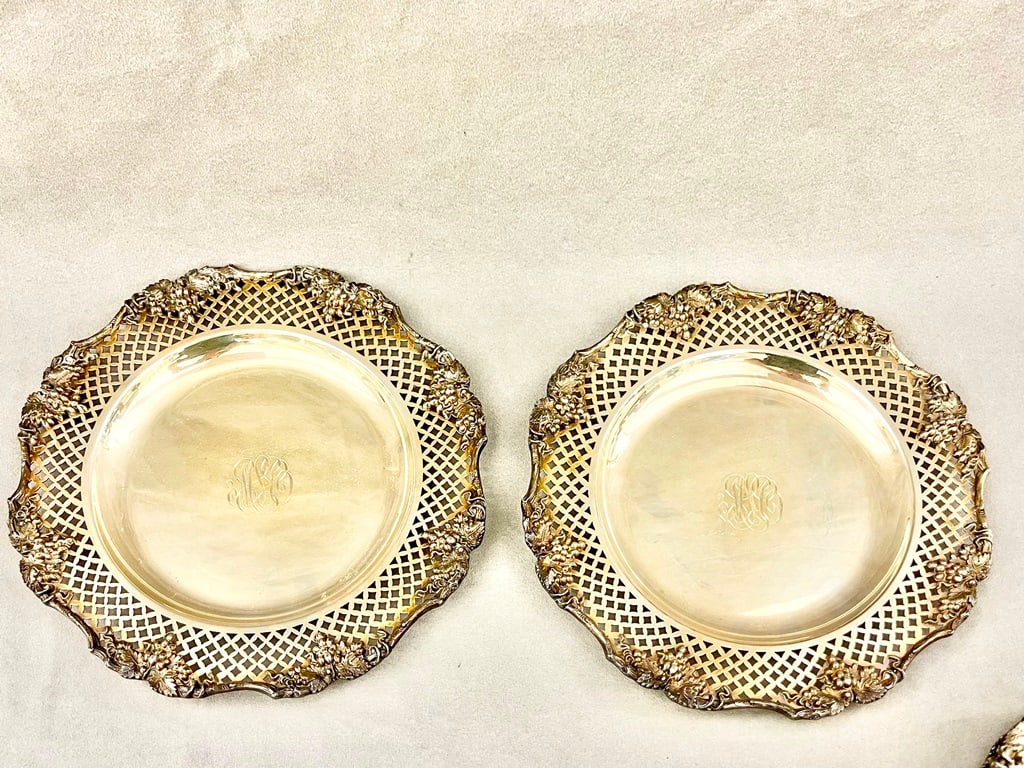 SET SIX HEAVY SILVER-PLATED SHAPED CIRCULAR PLATES, - D: 11 1/4 in.: SET SIX HEAVY SILVER-PLATED SHAPED CIRCULAR PLATES. Wide, lattice-pierced borders spaced by grape motifs; monogrammed centers - D: 11 1/4 in.