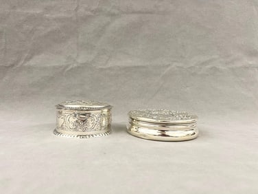 TWO SILVER LIFT-COVER CIRCULAR POWDER BOXES, 19th-early 20th century. - Wt. 15 troy oz.