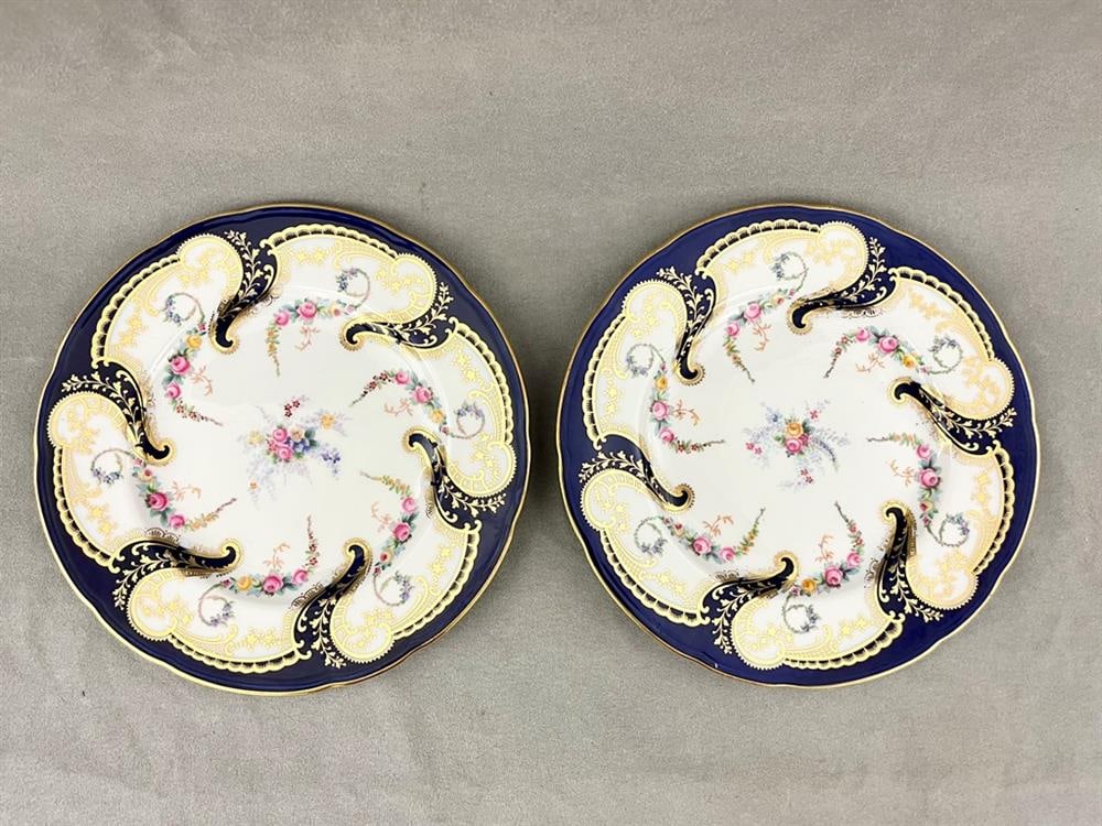 SET SEVEN COBALT AND GILT PORCELAIN LUNCHEON PLATES WITH FLORAL DECORATION, late 19th-early 20th: SET SEVEN COBALT AND GILT PORCELAIN LUNCHEON PLATES WITH FLORAL DECORATION, late 19th-early 20th century. - D: 9 3/8 in.