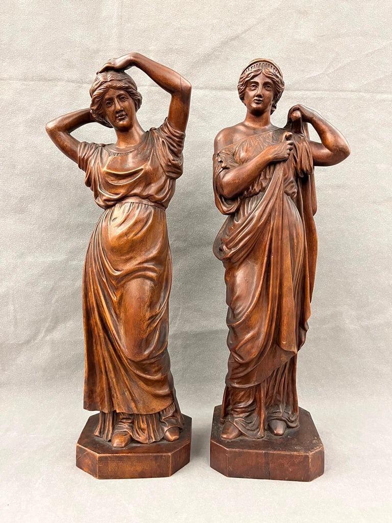 PAIR CARVED WOODEN FIGURES OF STANDING NEOCLASSICAL MAIDENS, 19th century. - H: 21 1/2 in.: PAIR CARVED WOODEN FIGURES OF STANDING NEOCLASSICAL MAIDENS, 19th century. - H: 21 1/2 in.