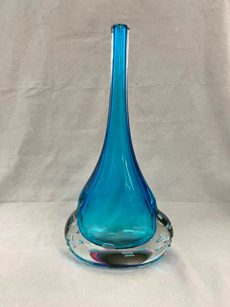 LUIGI MELLARA (ITALIAN) TRANSPARENT TURQUOISE-COLOR, BUBBLED ASYMMETRICAL DROP-FORM MURANO ART GLASS: LUIGI MELLARA (ITALIAN) TRANSPARENT TURQUOISE-COLOR, BUBBLED ASYMMETRICAL DROP-FORM MURANO ART GLASS VASE, Signed "Mellara". - H: 22 in.