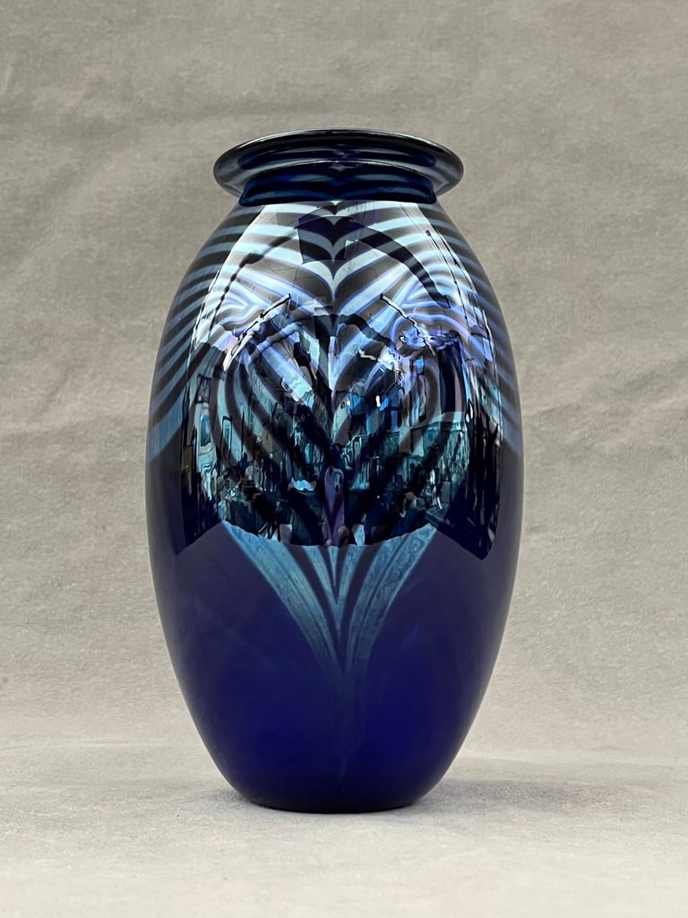 ROBERT EICKHOLT ART GLASS VASE, dated 1983. - 7 5/8 in. x 4 1/8 in.: ROBERT EICKHOLT ART GLASS VASE, dated 1983. Blue and silver swirls - 7 5/8 in. x 4 1/8 in.