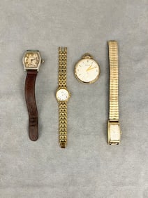 FOUR ASSORTED VINTAGE WATCHES.