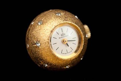 LADY'S BUCHERER YELLOW GOLD-PLATED TEXTURED ORB-FORM PENDANT WATCH. - D: 3/4 in.