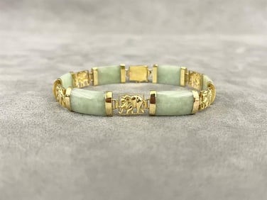 CHINESE 14K YELLOW GOLD AND CELADON JADE FLEXIBLE-LINK BRACELET.