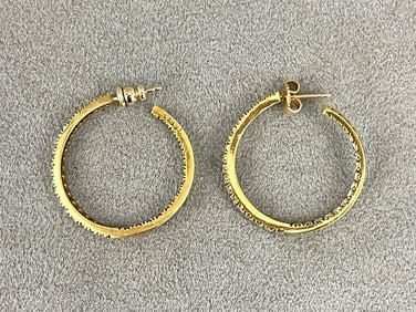 PAIR 14K BRIGHT-POLISHED YELLOW GOLD AND DIAMOND IN-AND-OUT HOOP EARRINGS.
