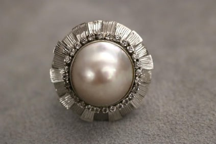 10K WHITE GOLD, DIAMOND AND MABE PEARL DOME RING.
