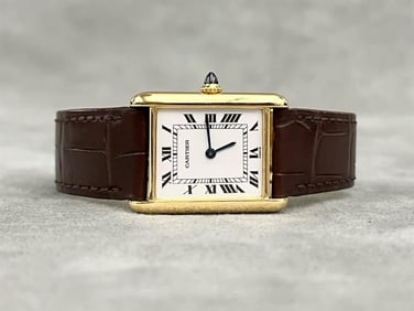 LADY'S CARTIER 18K YELLOW GOLD TANK WATCH.