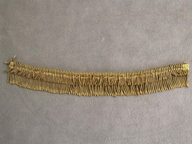 18K (750) YELLOW GOLD FLEXIBLE FRINGE BRACELET.
