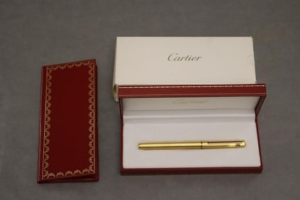 CARTIER GOLD FINISH ROLLER BALL PEN.