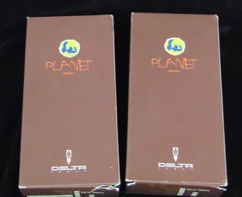 TWO DELTA "PLANET COLLECTION" VERMEIL ROLLER BALL PENS. Africa and Amazzonia models.
