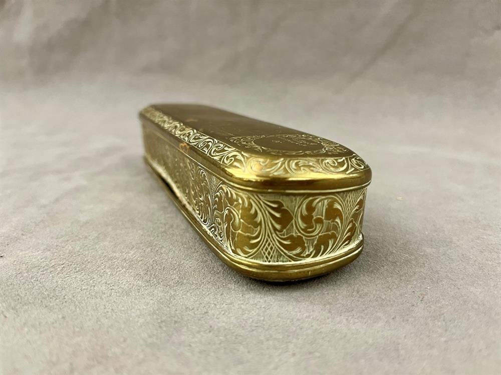 DUTCH BRASS HINGED-TOP TOBACCO BOX, 18th-19th century. - L: 7 in.: DUTCH BRASS HINGED-TOP TOBACCO BOX, 18th-19th century. Oblong, chased with scenes of palace life and warriors. - L: 7 in.