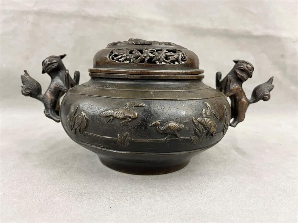 CHINESE BRONZE CIRCULAR INCENSE POT WITH PIERCED LIFT COVER AND PAIR FU DOG HANDLES. - D: 7 1/2 in.: CHINESE BRONZE CIRCULAR INCENSE POT WITH PIERCED LIFT COVER AND PAIR FU DOG HANDLES. - D: 7 1/2 in.