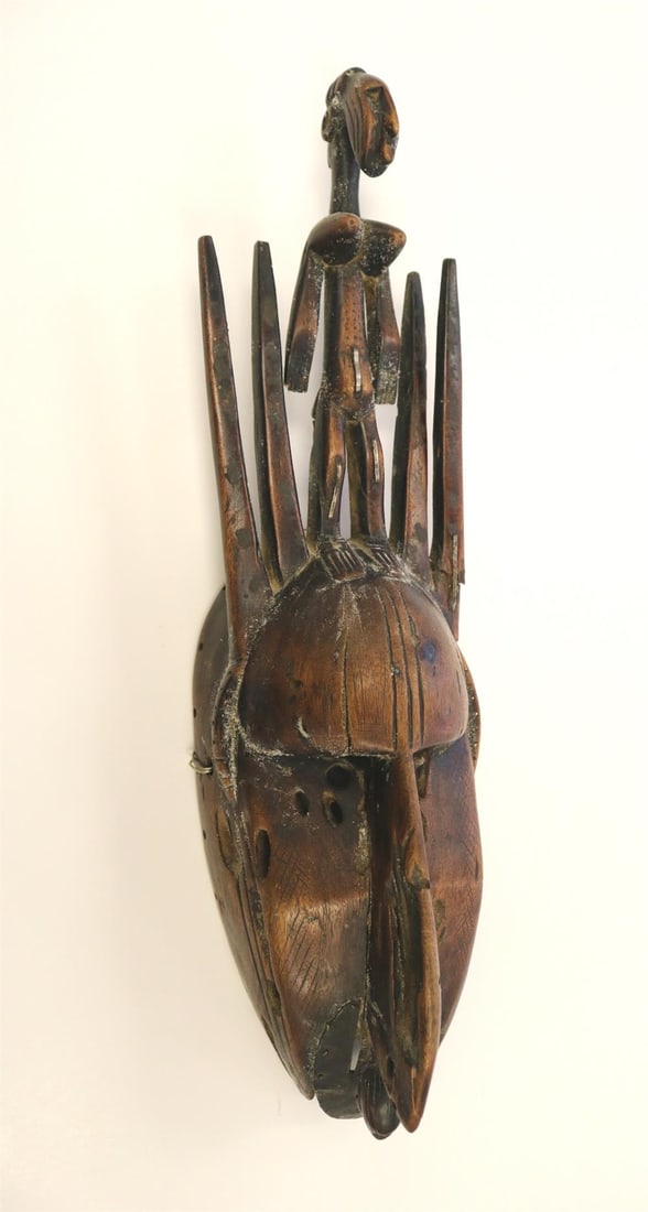 BAMANA MALI MALE WOODEN ZOOMORPHIC MASK, Early 20th century. - Height: 21 inches.: BAMANA MALI MALE WOODEN ZOOMORPHIC MASK, Early 20th century. Patinated hand carved mask made of wood and metal by the Bamana People, Mali, Africa. The mask. - Height: 21 inches.