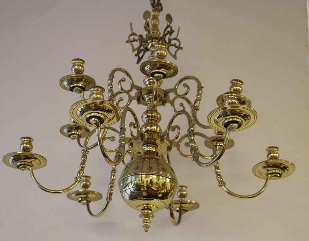 TWELVE-LIGHT BRASS CHANDELIER MADE BY LESTER BERRY IN THE STYLE OF DUTCH EXAMPLES FROM THE 17TH: TWELVE-LIGHT BRASS CHANDELIER MADE BY LESTER BERRY IN THE STYLE OF DUTCH EXAMPLES FROM THE 17TH CENTURY. Twelve swan-like arms, secured by flat tenons, and locked by round pins; one-piece core; reflec