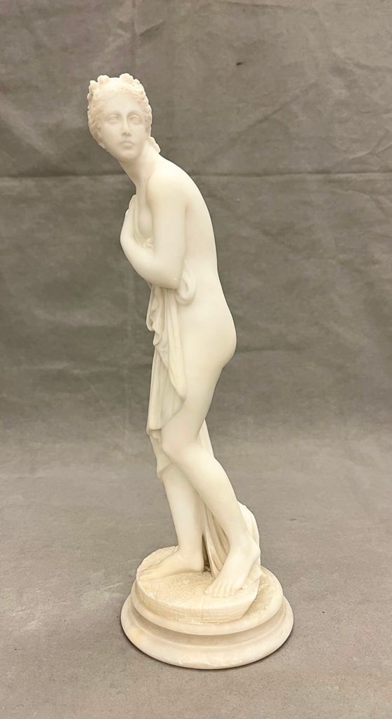 HEBE BY ADAMO TADOLINI AFTER ONE BY ANTONIO CANOVA (ITALY, 1757-1822). - H: 32 in.: HEBE BY ADAMO TADOLINI AFTER ONE BY ANTONIO CANOVA (ITALY, 1757-1822). HEBE BY ADAMO TADOLINI AFTER ONE BY ANTONIO CANOVA (ITALY, 1757-1822). White marble. Signed at base "A Tadolini, Rome" and possi